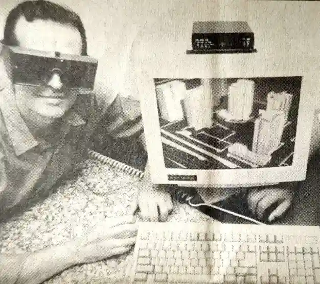 Foto de jornal: pessoa com óculos de realidade virtual diante de um computador exibindo um prédio em 3D